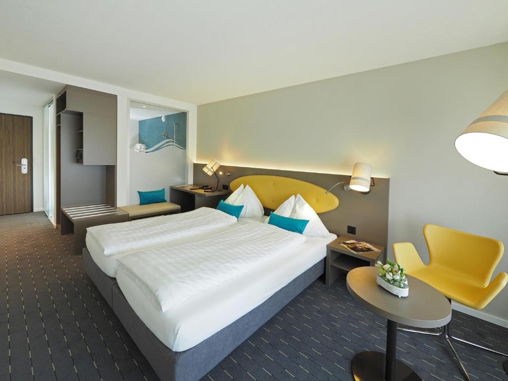
Ein Bett oder Betten in einem Zimmer der Unterkunft Hotel Restaurant Holiday
