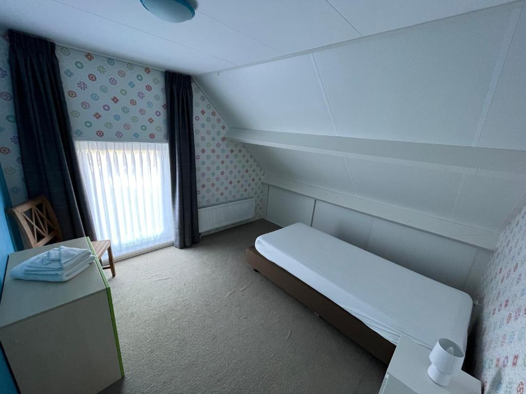Postel nebo postele na pokoji v ubytování Vakantiehuis de Turfvaart