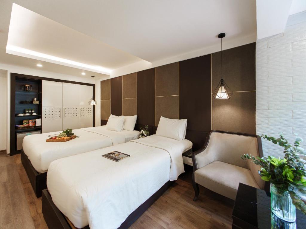 Postel nebo postele na pokoji v ubytování Keypad Hotel - 24 Hang Ga