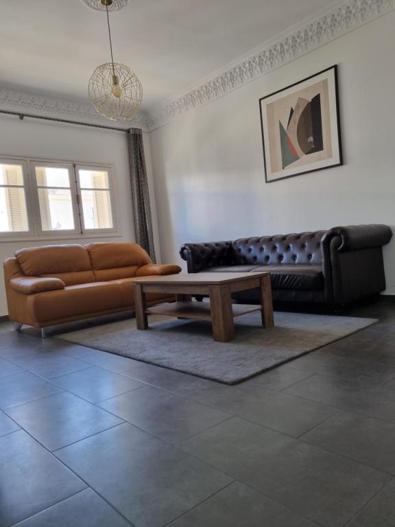 a living room with a couch and a coffee table at Tanger -Madina in Tangier