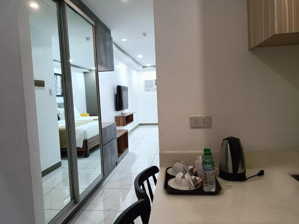 Kuchyň nebo kuchyňský kout v ubytování Rosh Hotel