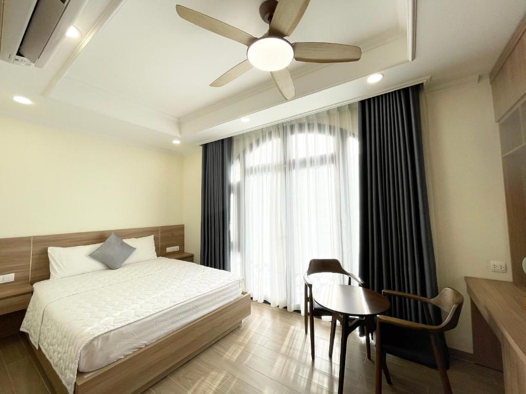 Postel nebo postele na pokoji v ubytování Cam Hotel Phu Quoc