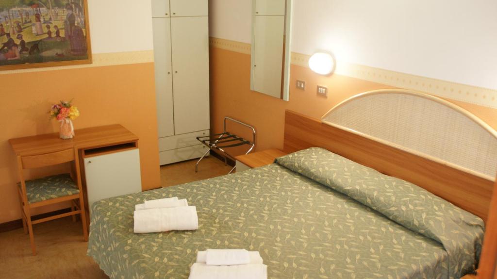 Postel nebo postele na pokoji v ubytování Hotel Verudella