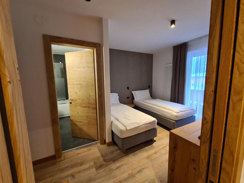 Posteľ alebo postele v izbe v ubytovaní Hotel Astoria