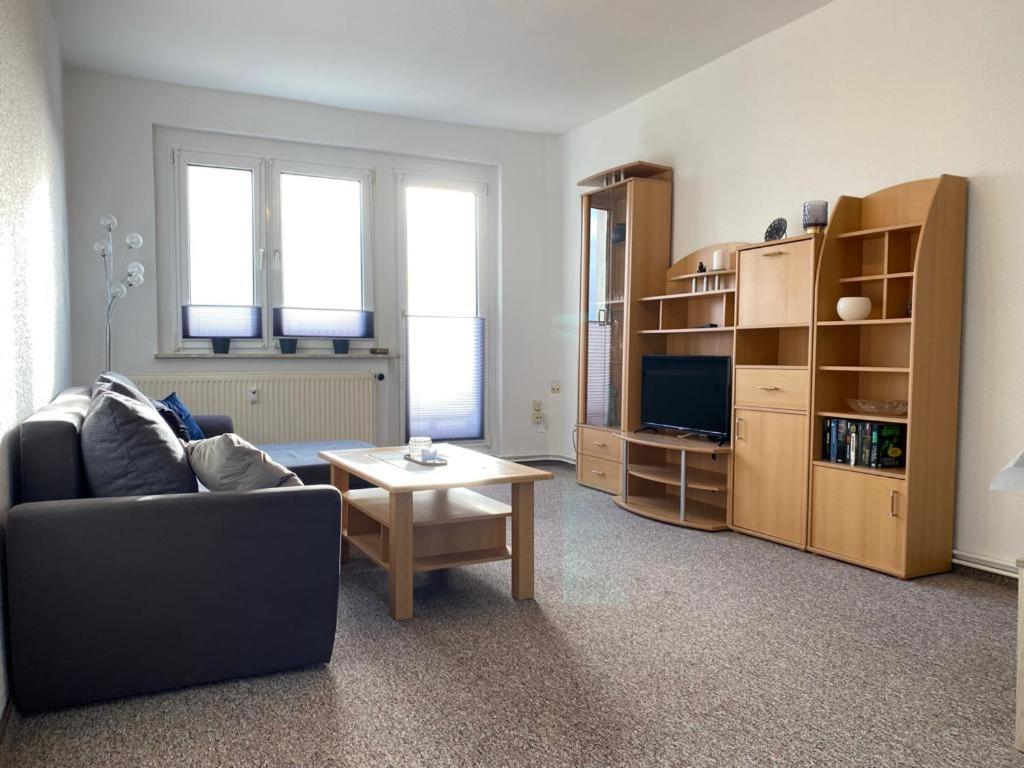 a living room with a couch and a table at Gästewohnung KL WZL 31 8 