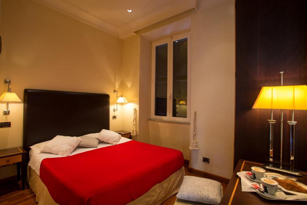 Postel nebo postele na pokoji v ubytování Hotel Giolitti