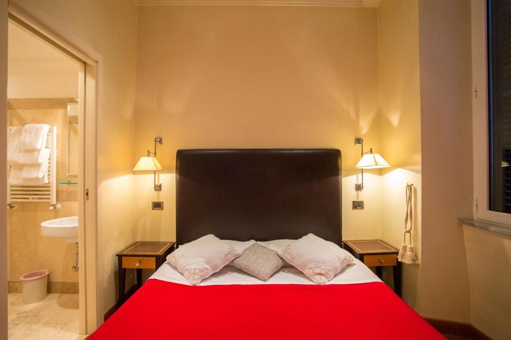 Postel nebo postele na pokoji v ubytování Hotel Giolitti