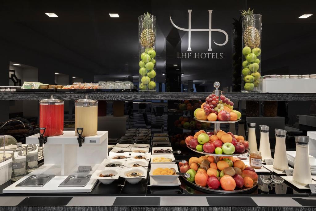 a buffet filled with lots of different types of food at LHP Napoli Palace & SPA in Naples