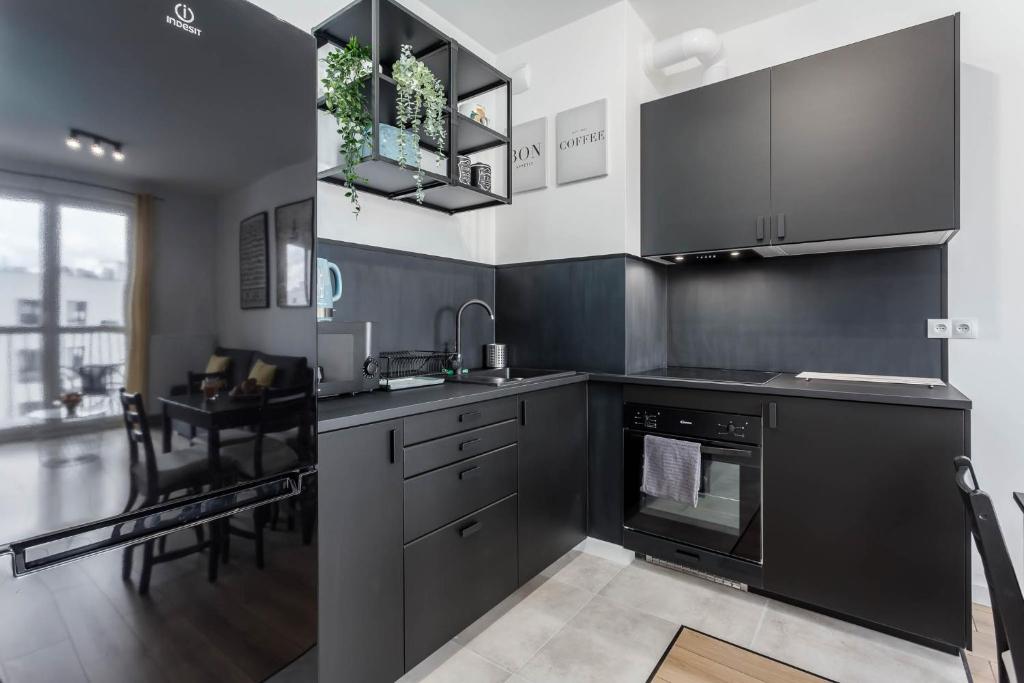 Kuchyňa alebo kuchynka v ubytovaní Chill Apartments Warsaw Airport