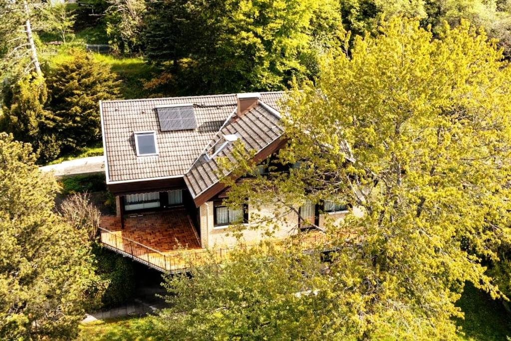 an aerial view of a house in the woods at Studiowohnung SchwabenALB mit Panoramablick in Albstadt