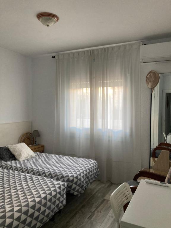 Postel nebo postele na pokoji v ubytování Apartament ca l'Irene