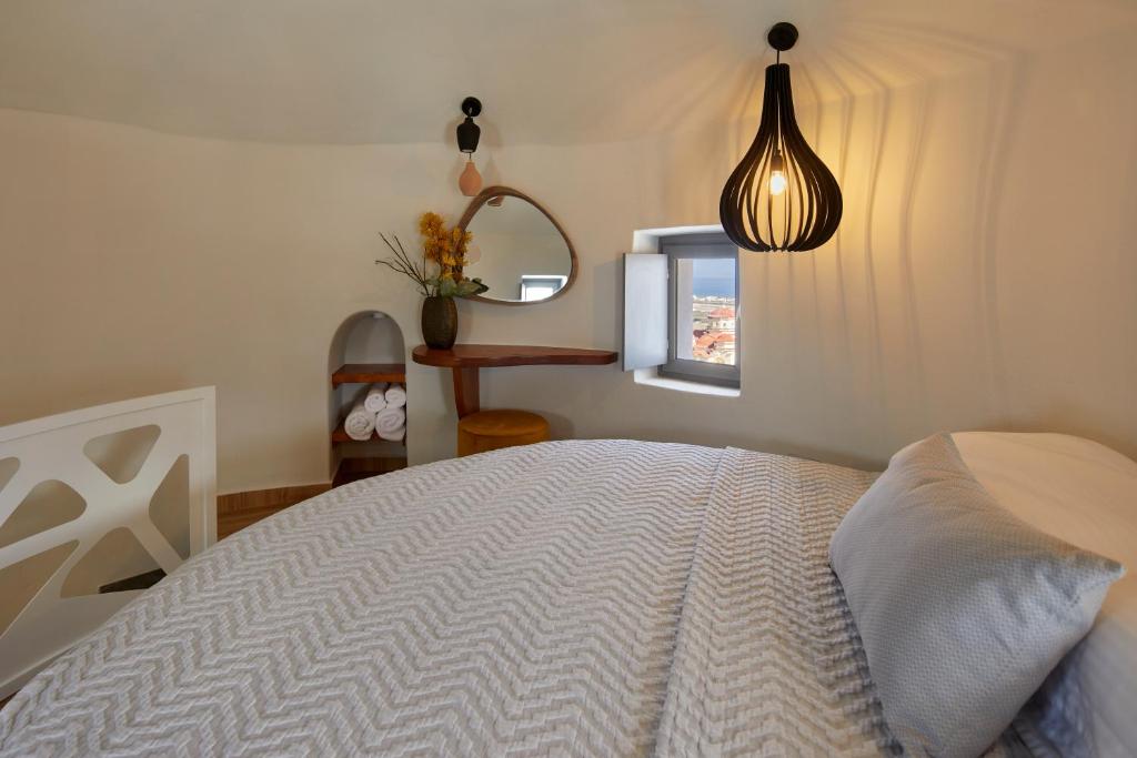 Letto o letti in una camera di Aecon Suites