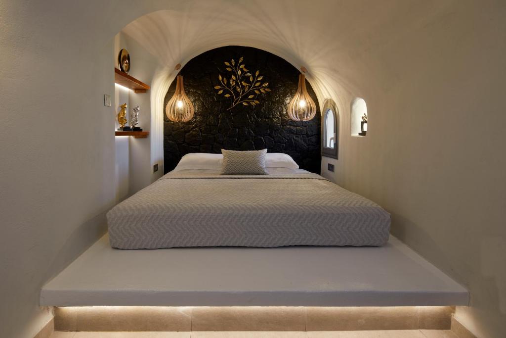 Letto o letti in una camera di Aecon Suites