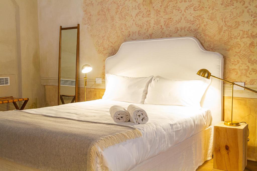 Posteľ alebo postele v izbe v ubytovaní Palazzo Glori 6