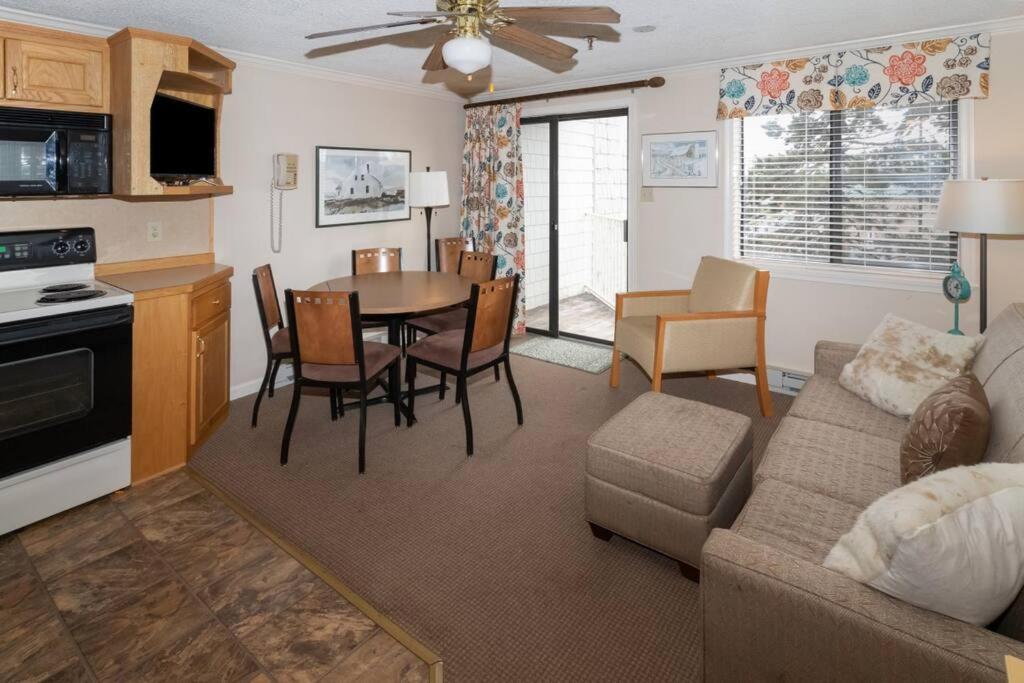 a living room with a couch and a table and chairs at ML229 Mountain Escape! Great for relaxing! 2BR 2BA in Snowshoe