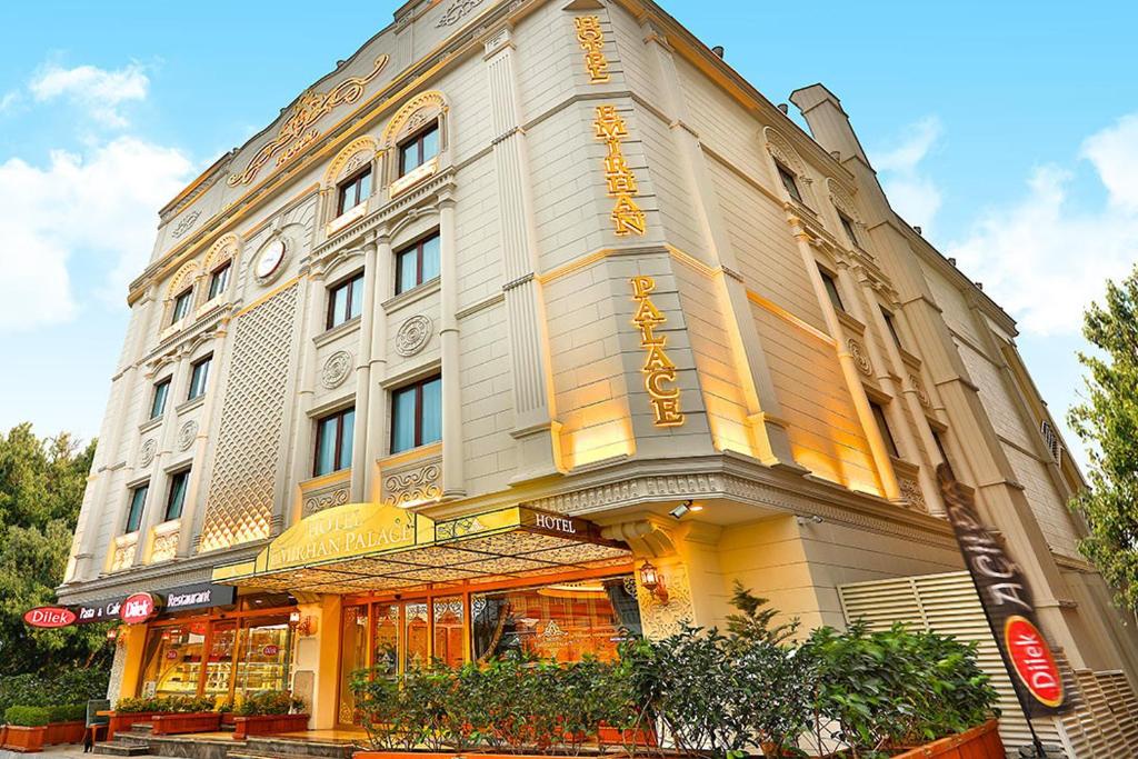 a large white building with a store front at Emirhan Palace Hotel in Istanbul