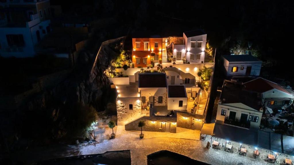an aerial view of a house at night at Amalthea Luxury Suites in Symi