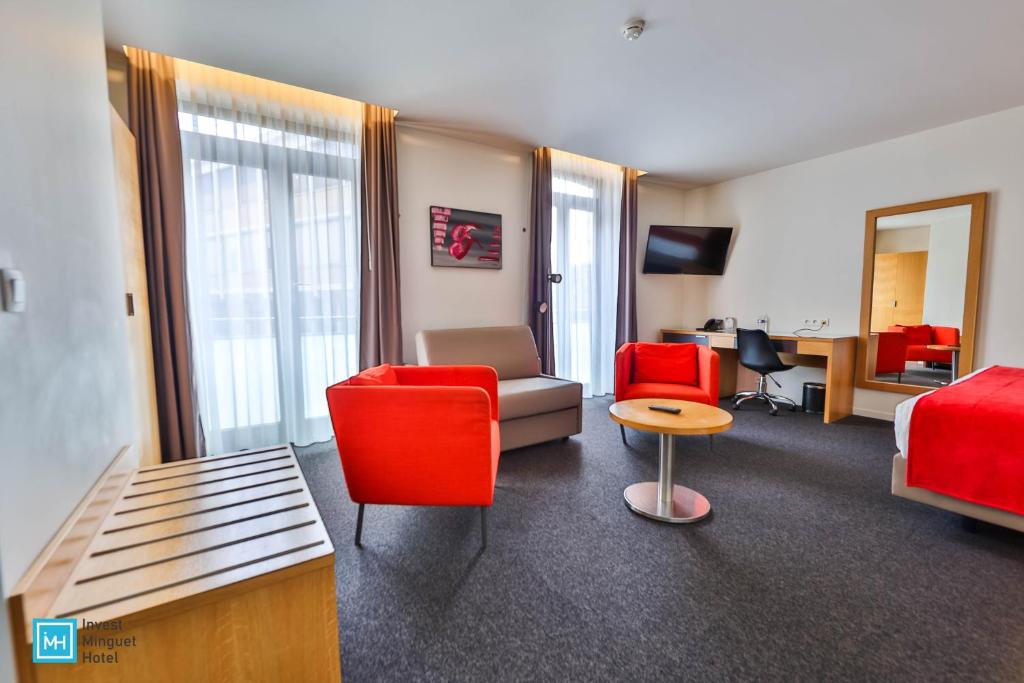 TV a/nebo společenská místnost v ubytování Hotel De La Couronne Liege