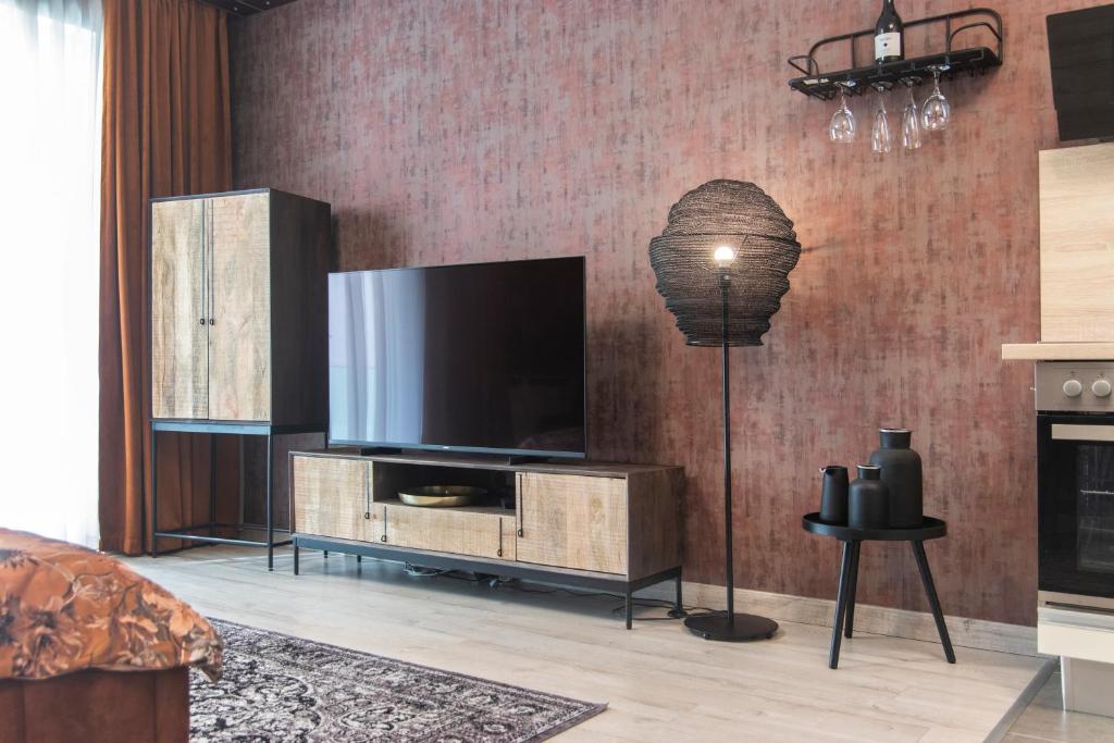 A television and/or entertainment centre at Grand Suites Corvin