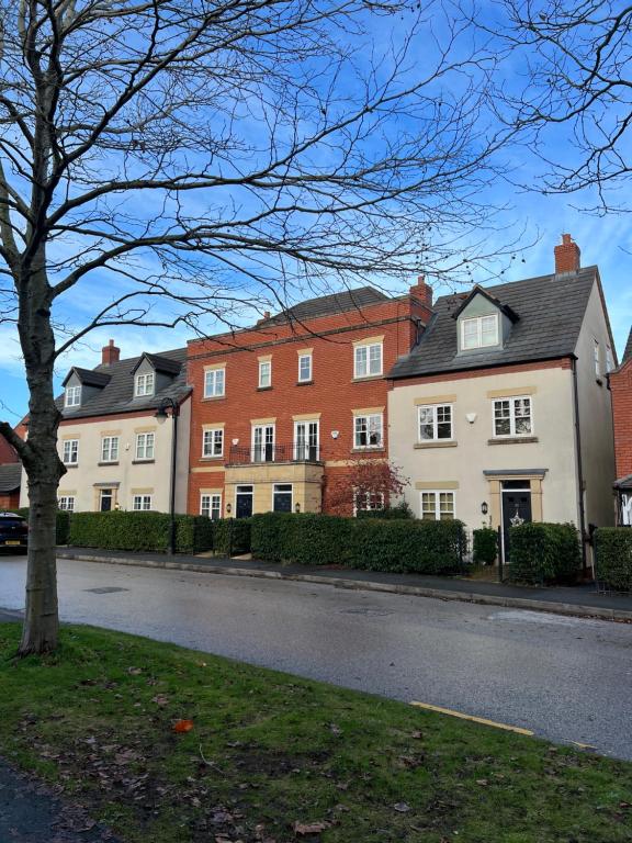 a row of houses on the side of a street at Upton Grange Townhouse in Chester