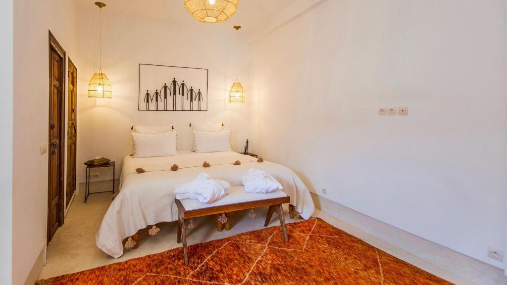 Postel nebo postele na pokoji v ubytování RIAD 48 & SPA
