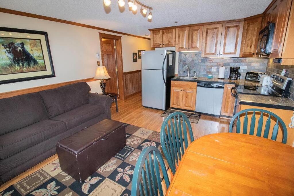a living room with a couch and a table and chairs at ML278 Mountaintop Retreat 2BR 2BA Lift Access Wifi in Snowshoe