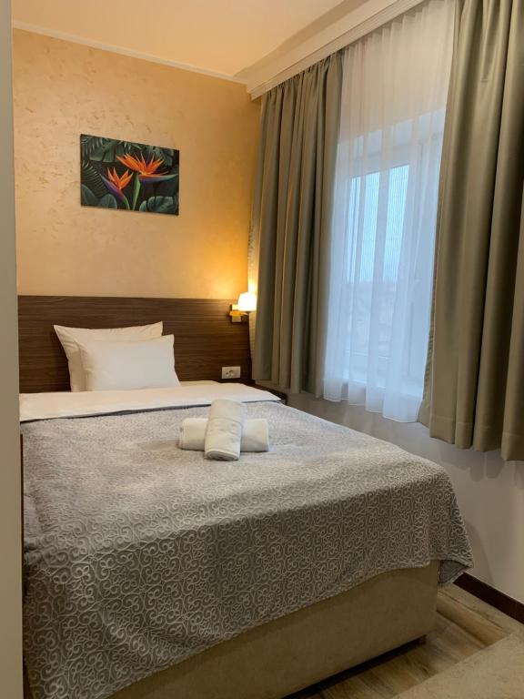 Postel nebo postele na pokoji v ubytování VILA MB