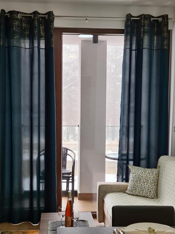 A seating area at Apartmani Gavric Borovi 2