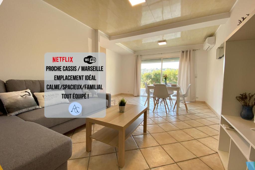 a living room with a couch and a table at ☆ L'évasion En Provence ☆ Clim-Wifi-Netflix ☆ in Carnoux