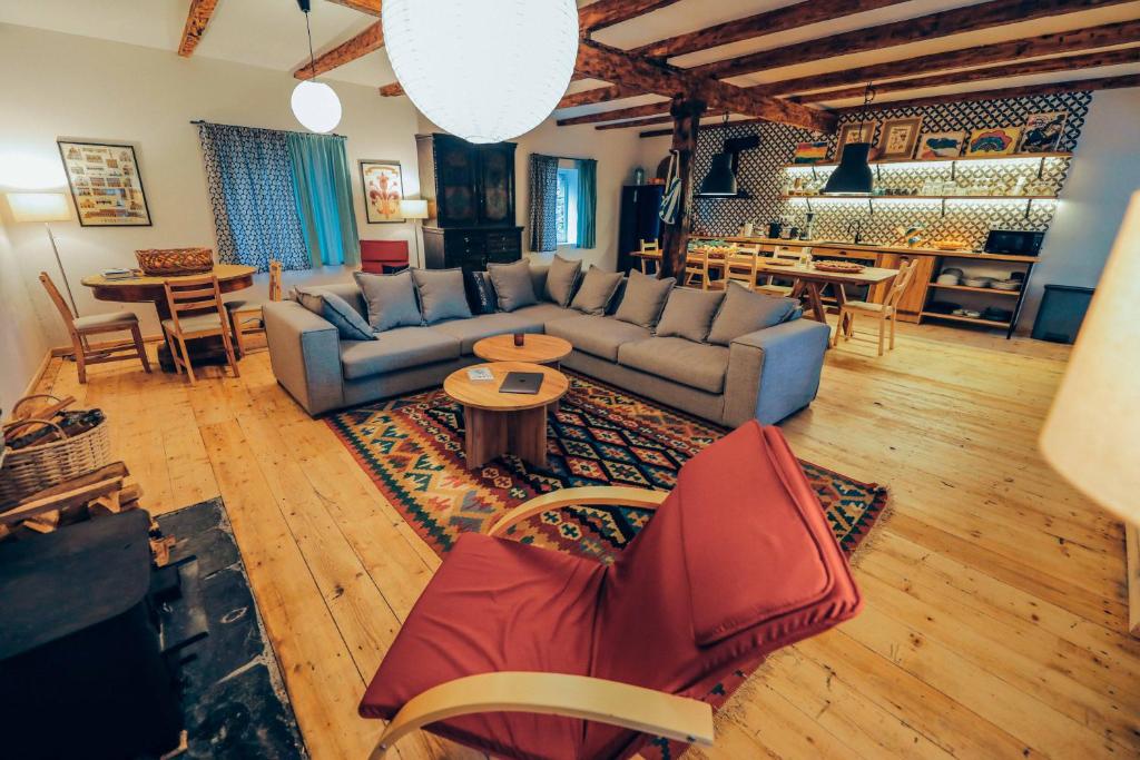 a living room with a couch and a table at JorJ'Inn in Lentekhi