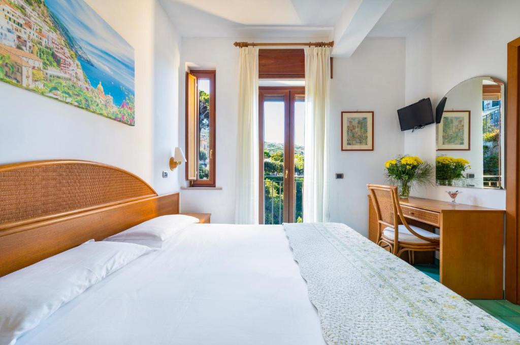 Postel nebo postele na pokoji v ubytování Hotel Sporting