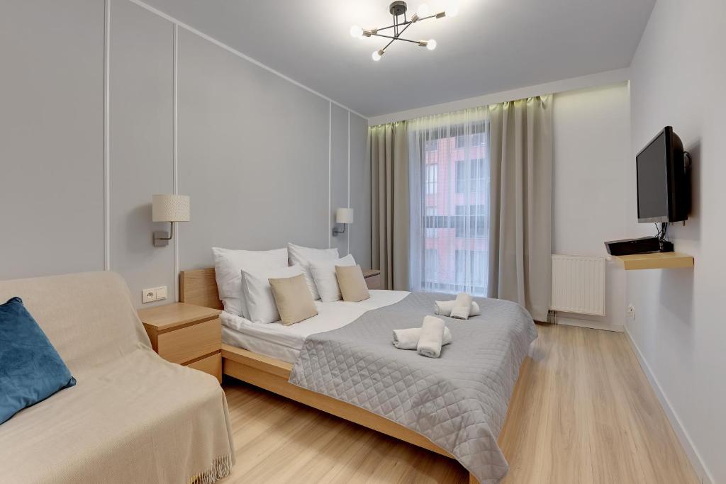 Posteľ alebo postele v izbe v ubytovaní Aura Apartments Old Town