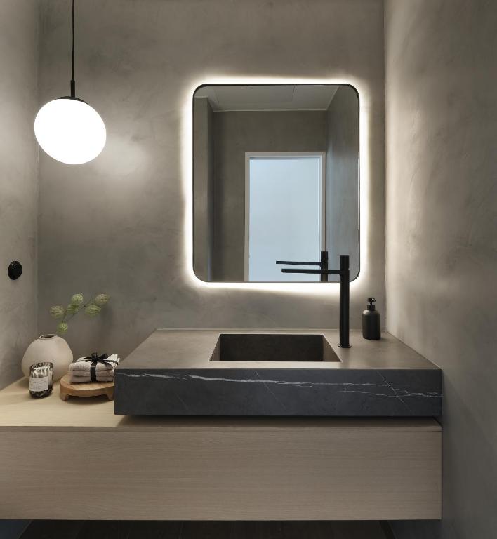 a bathroom with a sink and a mirror at Villa Sofia Cascais in Cascais