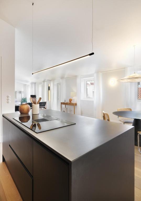 a kitchen with a sink and a counter top at Villa Sofia Cascais in Cascais