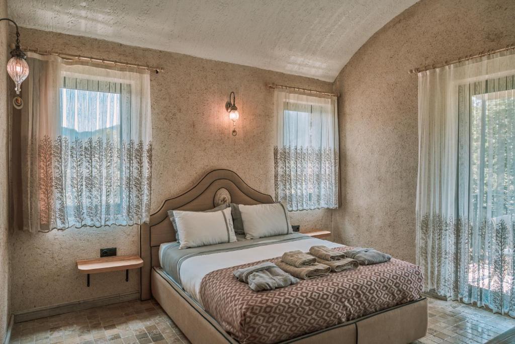 Postel nebo postele na pokoji v ubytování Turunç House Kayaköy