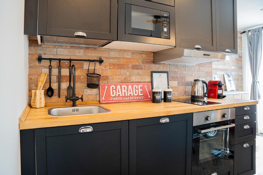 Kuchyň nebo kuchyňský kout v ubytování Vespa Apartments