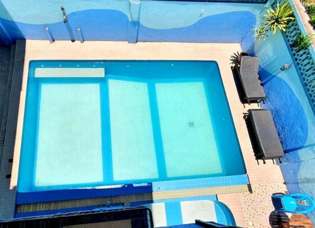 an overhead view of a blue swimming pool at Mombasa Shanzu One Bedroom Apartment /Swimming Pool/Free WiFi in Mombasa
