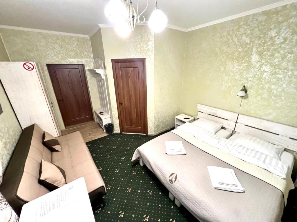 Postel nebo postele na pokoji v ubytování Viktan Hotel