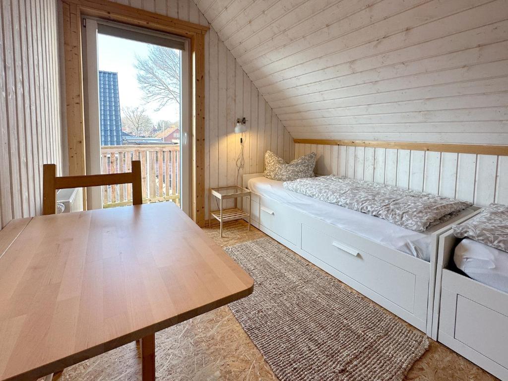 Postel nebo postele na pokoji v ubytování Ferienwohnungen im Schwedenstil