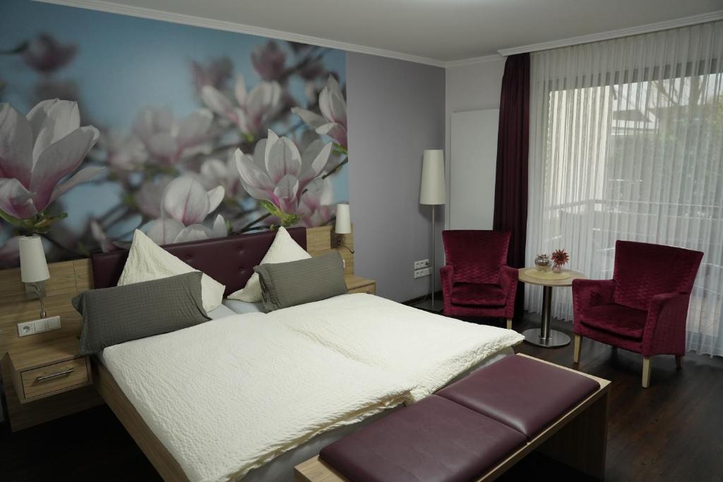 Postel nebo postele na pokoji v ubytování Hotel Dreyer Garni