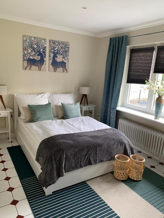 Postel nebo postele na pokoji v ubytování Ferienhaus Bendestorf, Waldweg 38,Nähe Hamburg