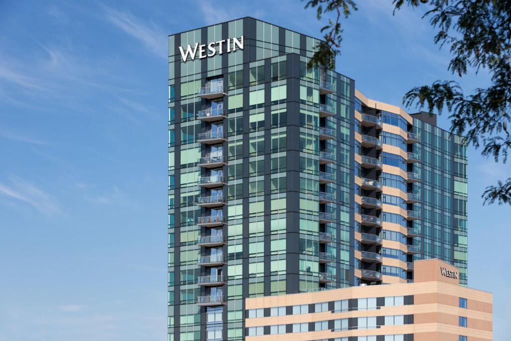 a tall building with a sign on top of it at The Westin Edina Galleria in Edina