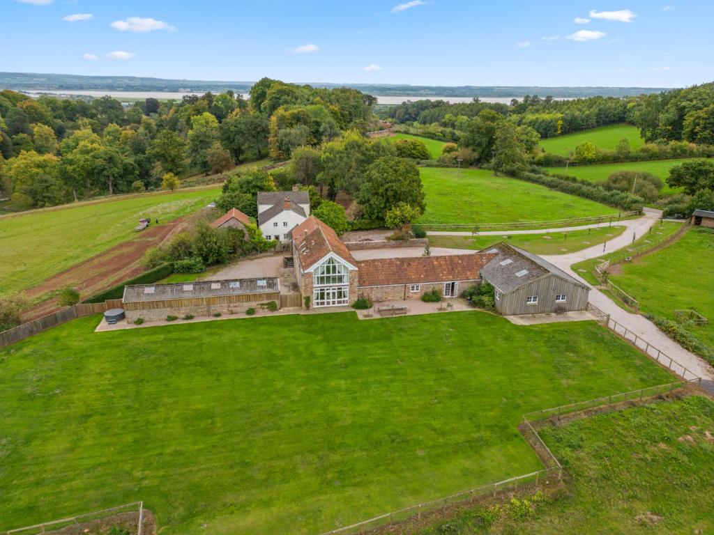 an aerial view of a large house on a green field at Lodge Barn in Lydney