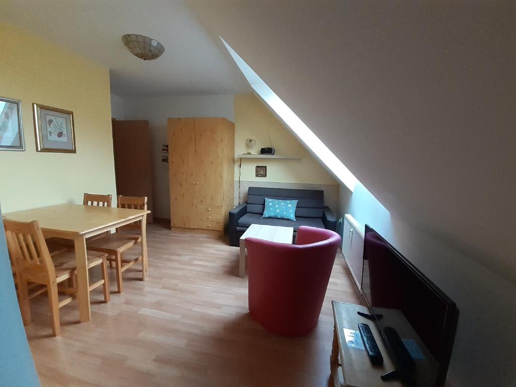 a living room with a couch and a table at Tisá 488 in Tisá