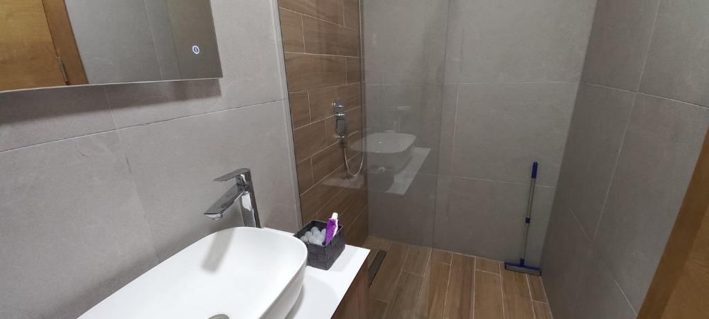 a bathroom with a sink and a toilet in it at Apartman GOLD in Bjelašnica