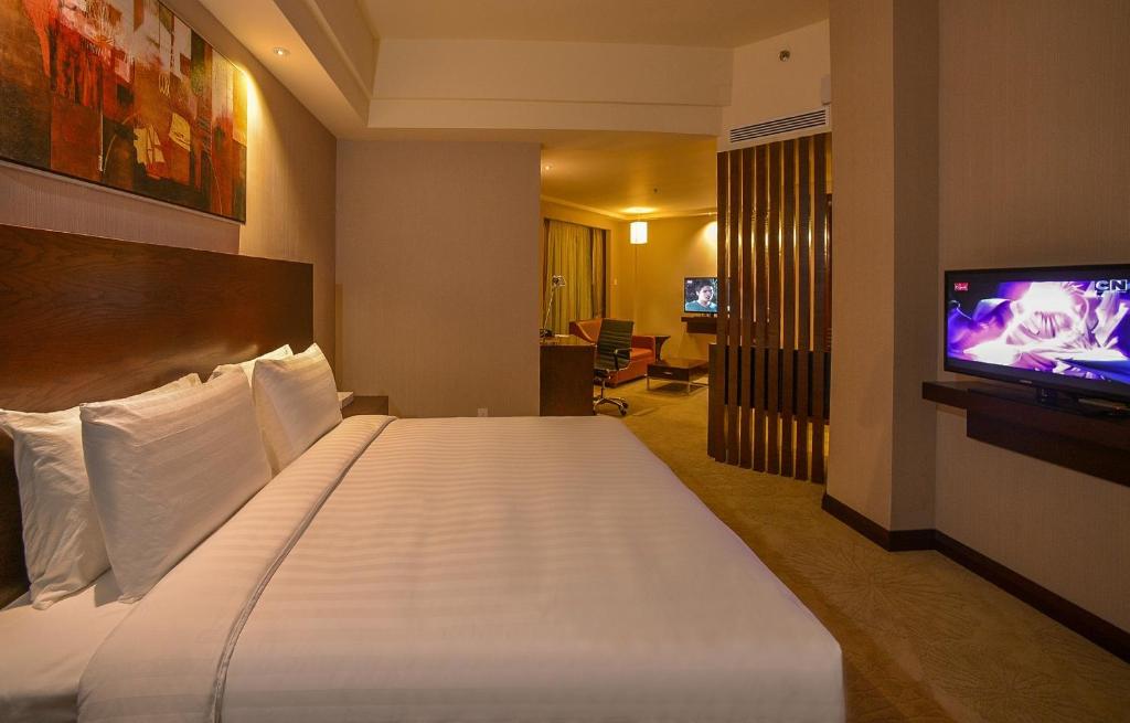 Postel nebo postele na pokoji v ubytování Widus Hotel Clark