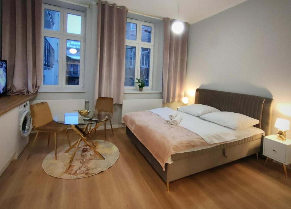 Ένα ή περισσότερα κρεβάτια σε δωμάτιο στο Hugo Star Apartments