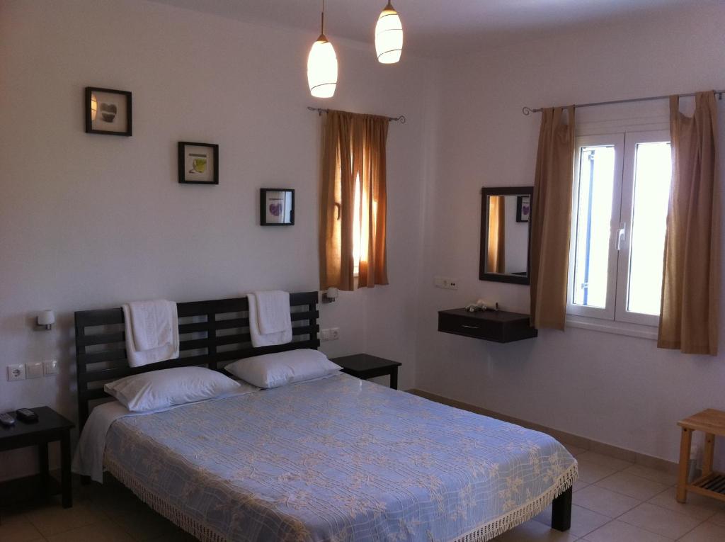 Postel nebo postele na pokoji v ubytování Elea Apartments
