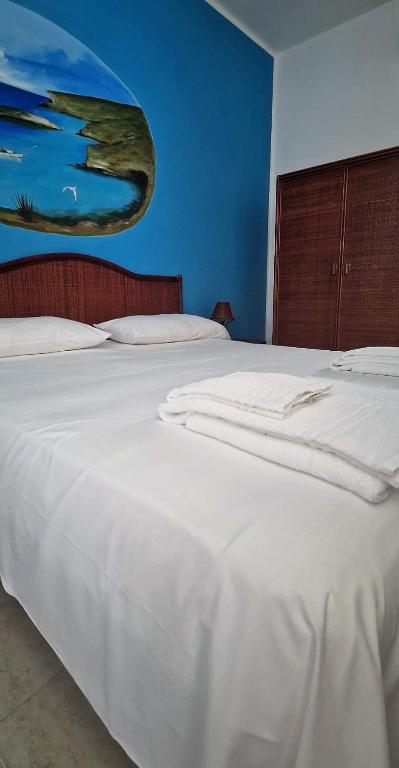 A bed or beds in a room at Case Pescatori