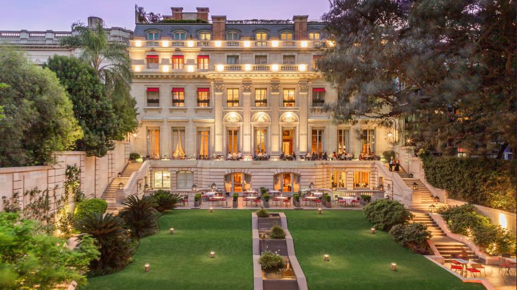 a large building with a lawn in front of it at Palacio Duhau - Park Hyatt Buenos Aires in Buenos Aires